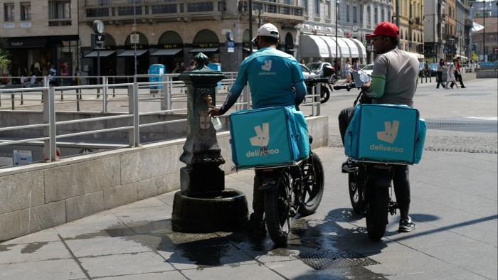 Deliveroo riders stop at a fountain for water in Milan, Italy on July 3 2025