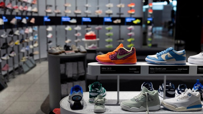 Nike shoes are seen on display at a retail outlet inside a shopping mall