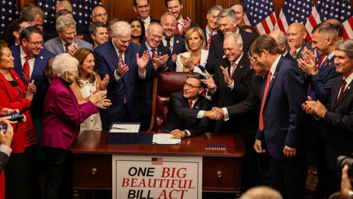 US House of Representatives Speaker Mike Johnson shake hands after signing Trump’s sweeping spending and tax bill