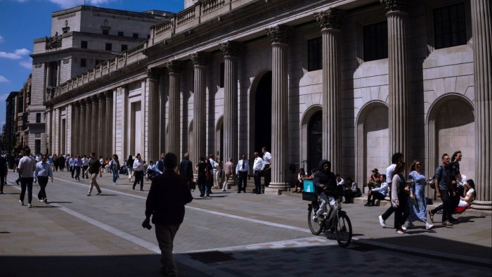 Pedestrians and cyclist go past the Bank of England in London, England on July 8 2025