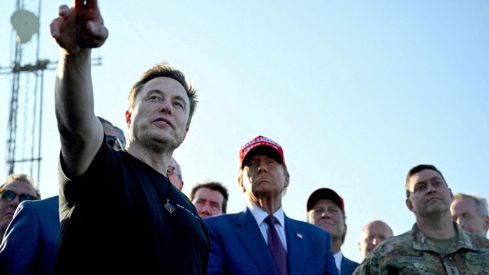 Elon Musk, left, and Donald Trump, centre, watching the test flight of a SpaceX Starship in Texas, US in November 2024