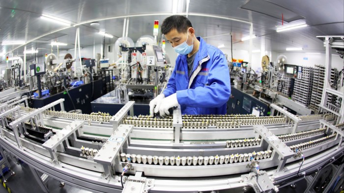 An employee works at a lithium battery manufacturing facility in Chian’s Anhui province