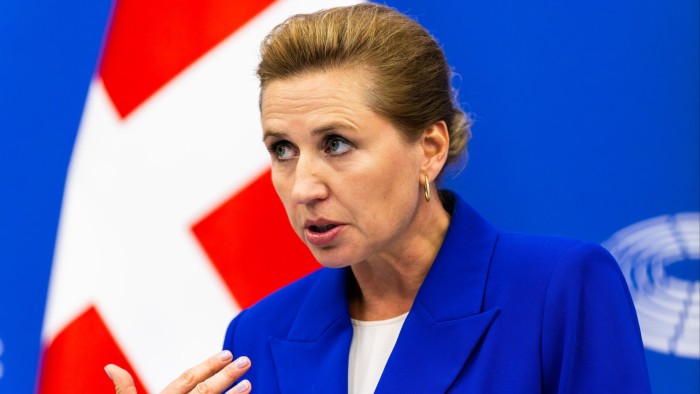 Mette Frederiksen at a news conference, standing in front of Danish flag on July 1 2025