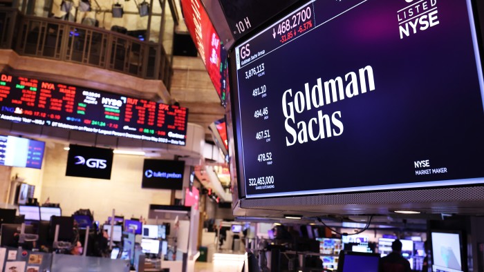 The Goldman Sachs company logo is displayed on a screen at the New York Stock Exchange