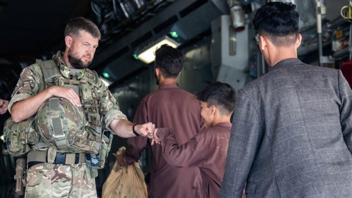 Members of the UK armed forces in August 2021 taking part in the evacuation of people from Kabul airport after the Taliban retook power