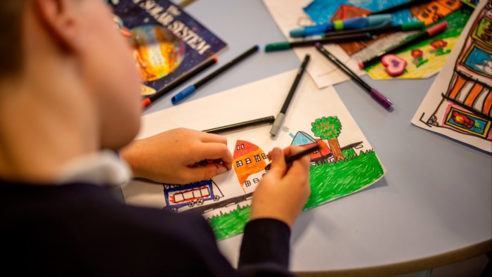 A child in a school draws