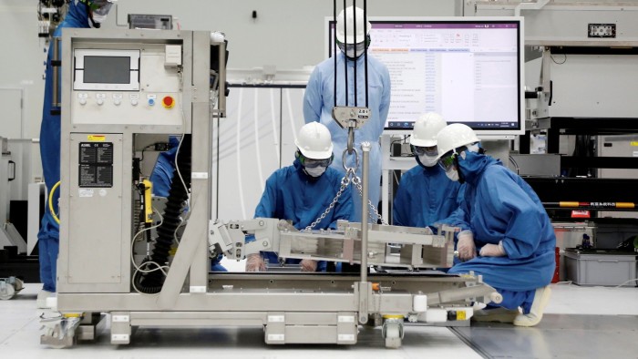 Trainees learning how to build and operate an EUV machine at an ASML facility in Taiwan