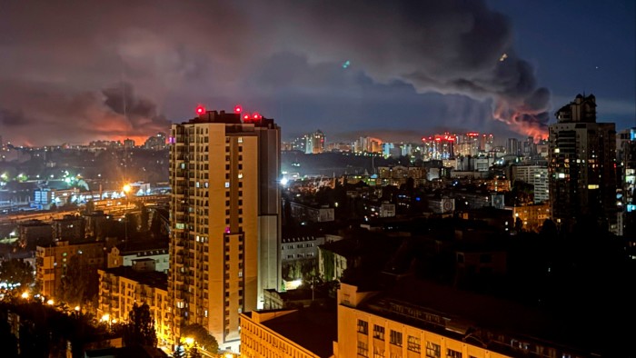Kyiv at night with smoke rising after a missile strike