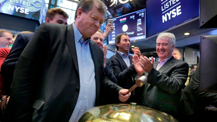 Paul Coulson, is applauded as he rings a ceremonial bell to mark the IPO of his company, on the floor of the New York Stock Exchange in 2017