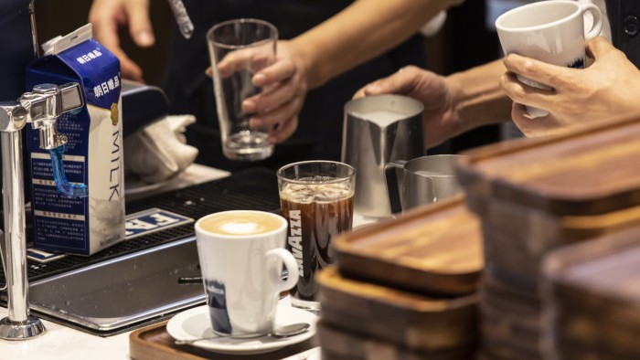 Employees prepare orders at a Lavazza cafe in Shanghai, China